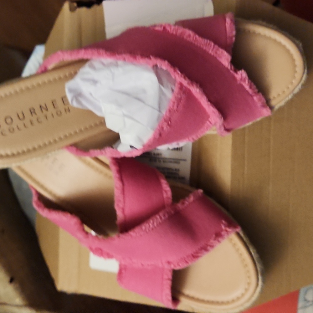 A pair of pink Wedge sandals,size 12 Journey Collection.They are cloth material.